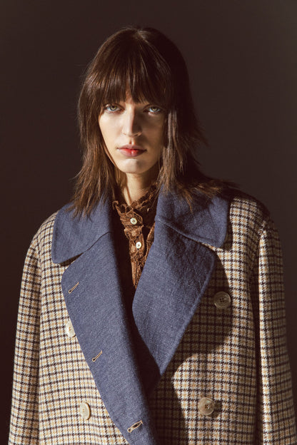 Pinstriped coat with striped finishes