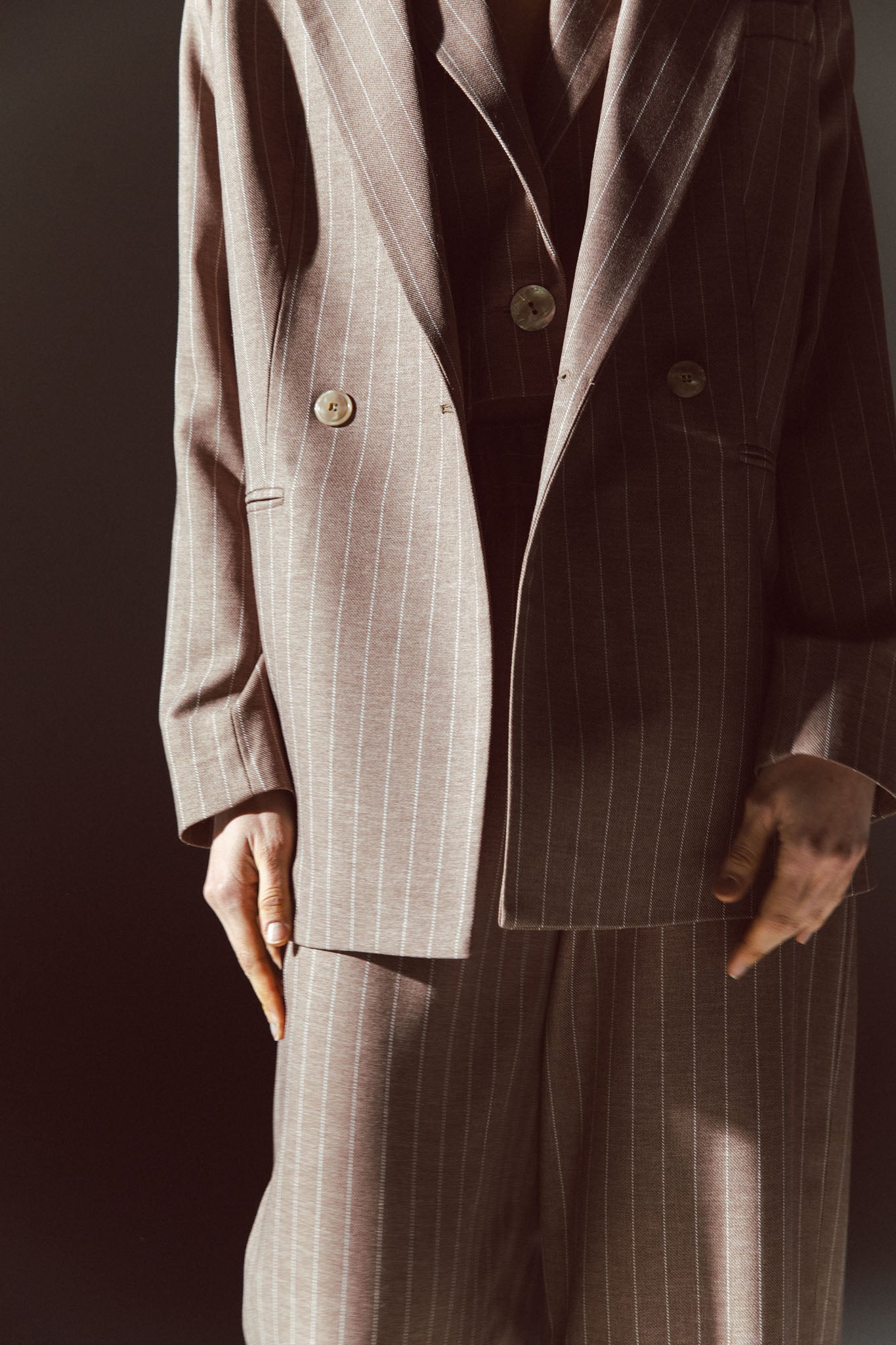 Pinstriped coat with striped finishes