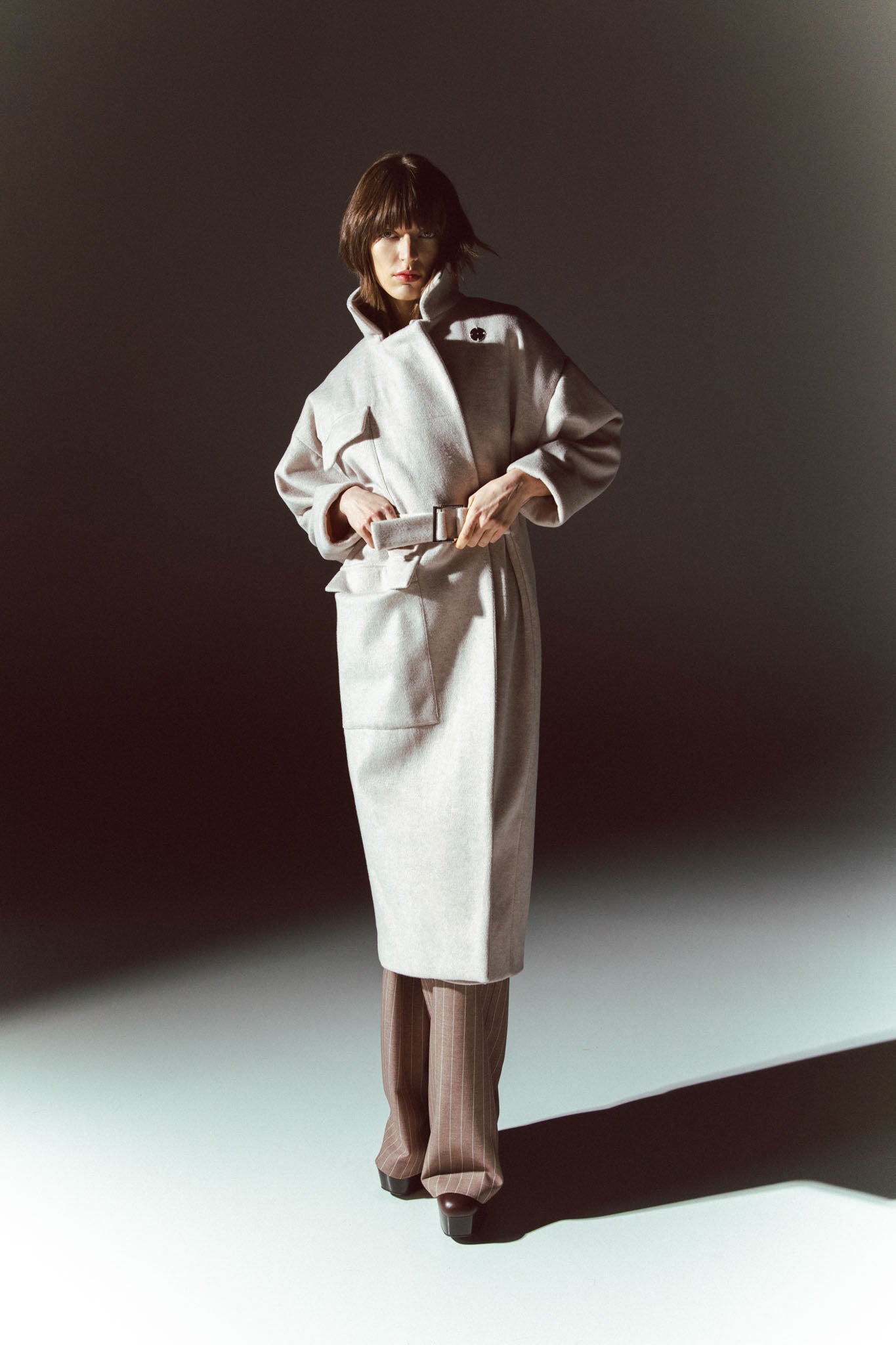 Pinstriped coat with striped finishes