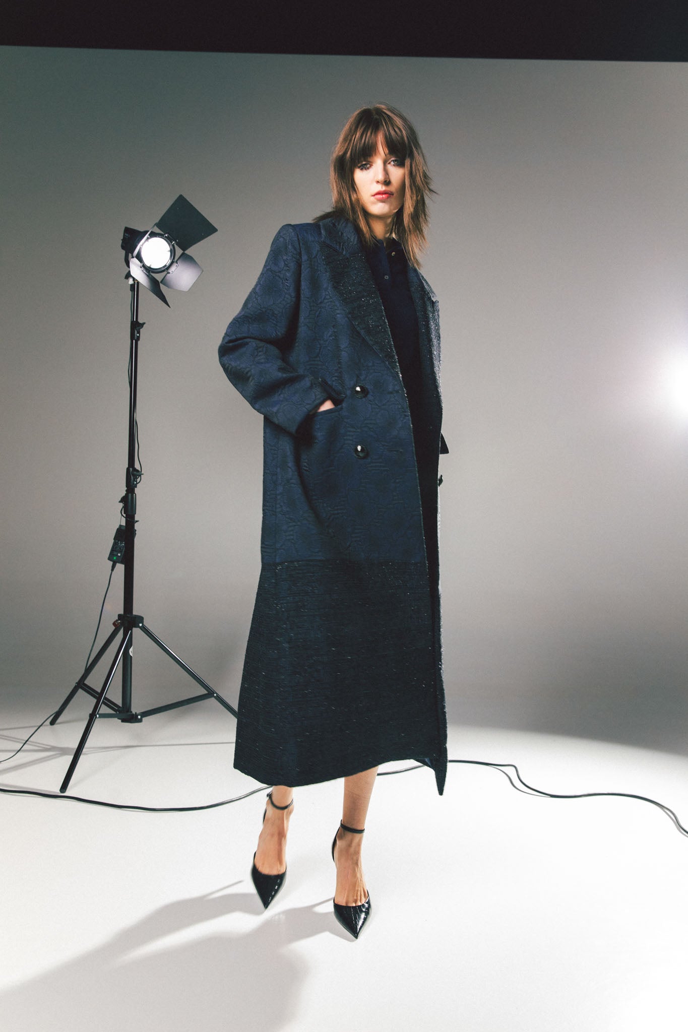 Pinstriped coat with striped finishes