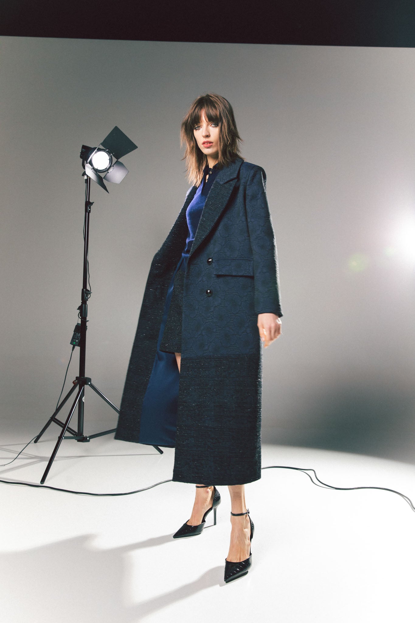 Pinstriped coat with striped finishes