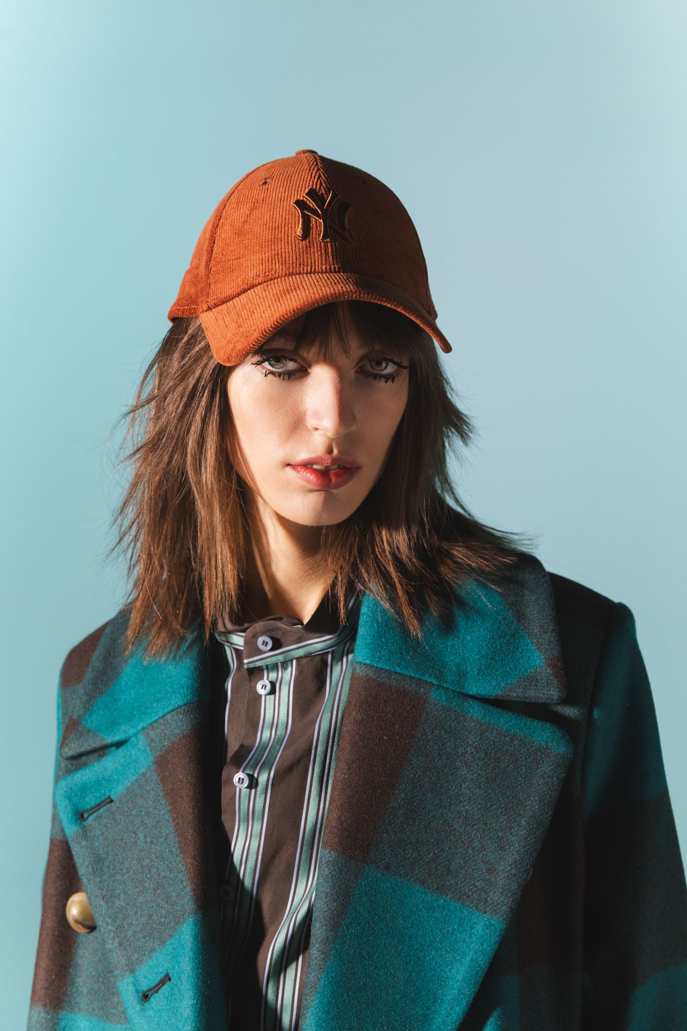 Pinstriped coat with striped finishes
